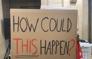 A message sends Barton House residents storming out from their own protest