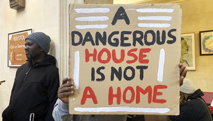 a person holding a sign