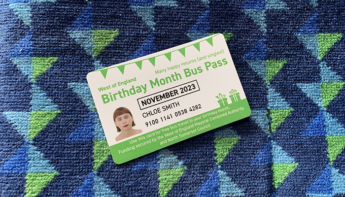 A bus card with a person's face on it.