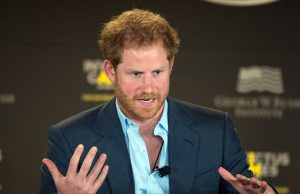 Prince Harry wins phone hacking trial in partial victory Prince Harry speaking with his hands up in motion.