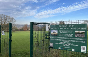A part of the fence around Stoke Lodge, with a poster from the campaign group.